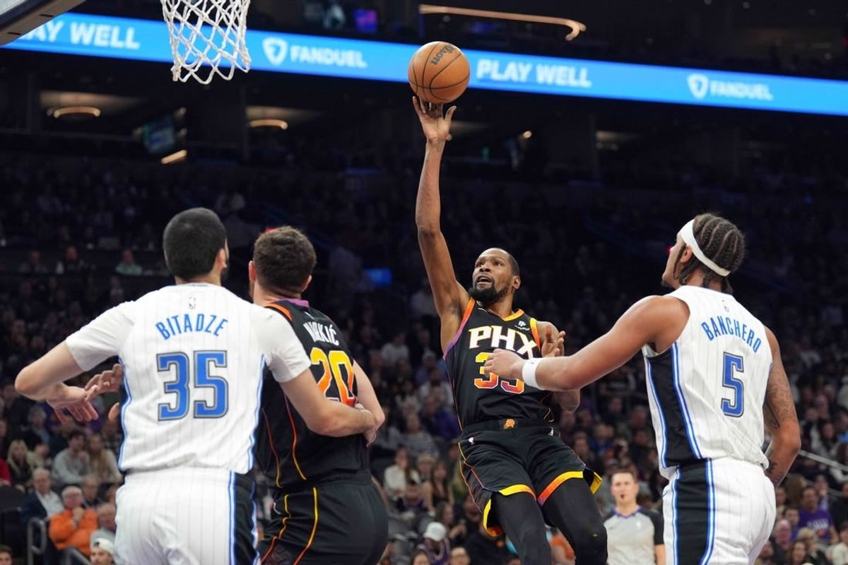 Dec 31, 2023; Phoenix, Arizona, USA; Phoenix Suns forward Kevin Durant (35) shoots against the Orlando Magic during the first half at Footprint Center.