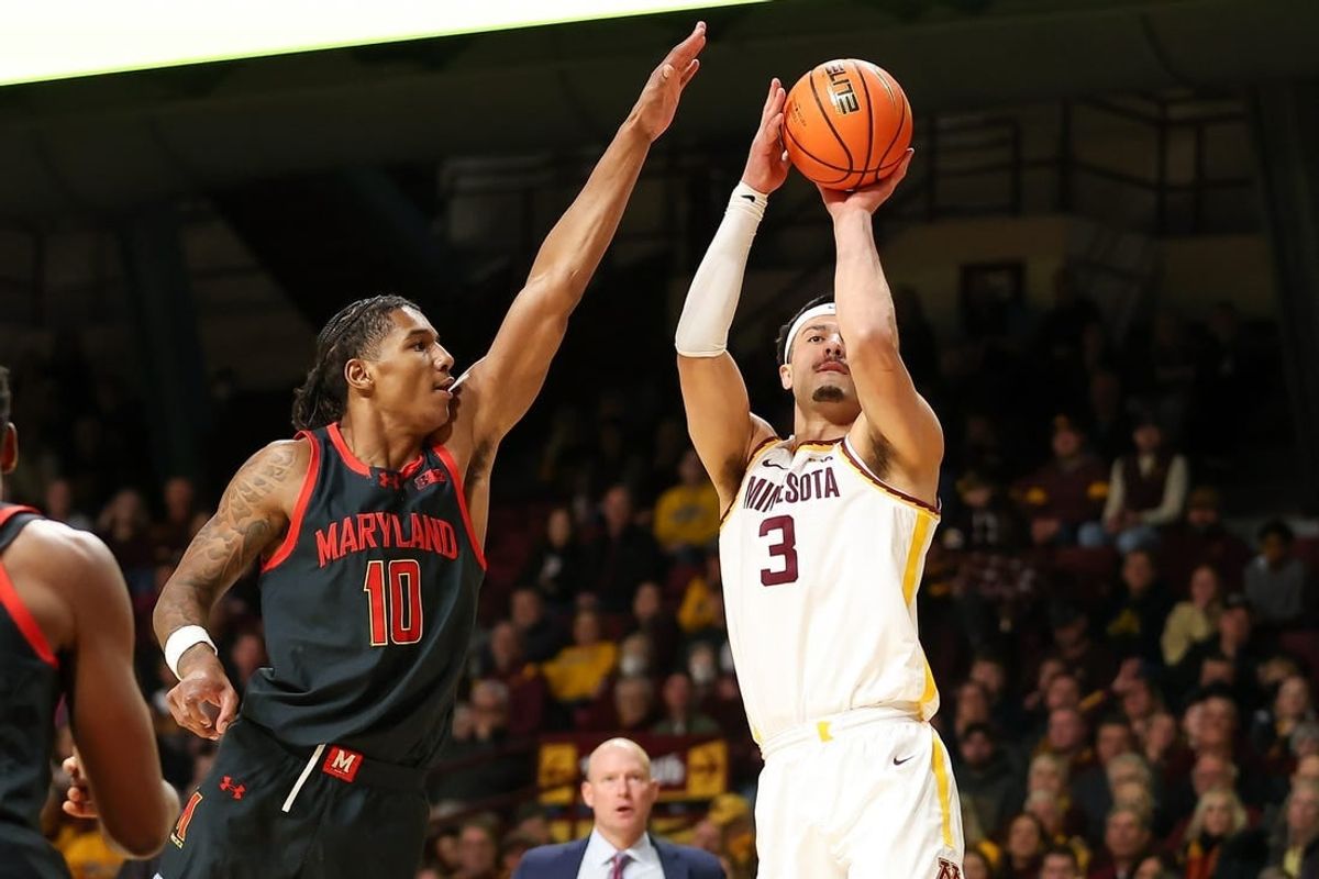 Jan 7, 2024; Minneapolis, Minnesota, USA; Minnesota Golden Gophers forward Dawson Garcia (3) shoots as Maryland Terrapins forward Julian Reese (10) defends during the first half at Williams Arena.