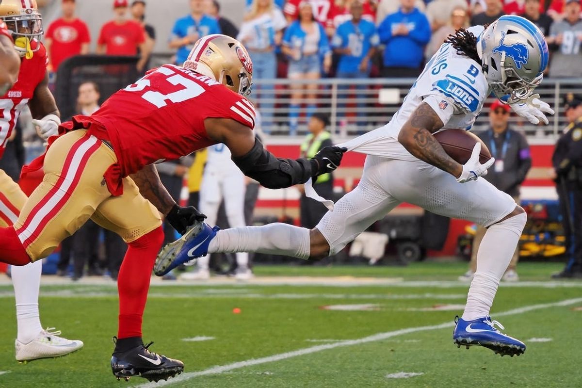 Jan 28, 2024; Santa Clara, California, USA; Detroit Lions wide receiver Jameson Williams (9) runs with the ball for a touchdown San Francisco 49ers linebacker Dre Greenlaw (57) during the first half of the NFC Championship football game at Levi's Stadium.