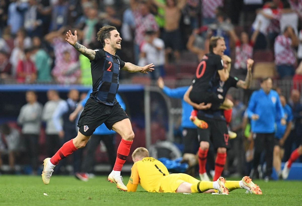 July 11, 2018; Moscow, Russia; Croatia defender Sime Vrsaljko (2) celebrates the 2-1 victory against England in front of goalkeeper Jordan Pickford (1) in the semifinals of the FIFA World Cup 2018 at Saint Petersburg Stadium. Mandatory Credit: Tim Groothuis/Witters Sport via Imagn Images