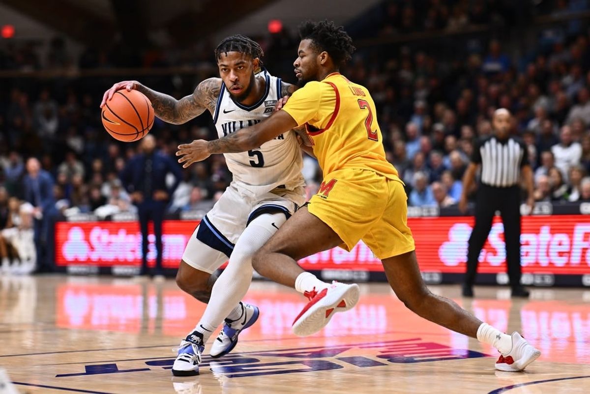 Nov 17, 2023; Villanova, Pennsylvania, USA; Villanova Wildcats guard Justin Moore (5) drives against Maryland Terrapins guard Jahari Long (2) in the first half at William B. Finneran Pavilion.