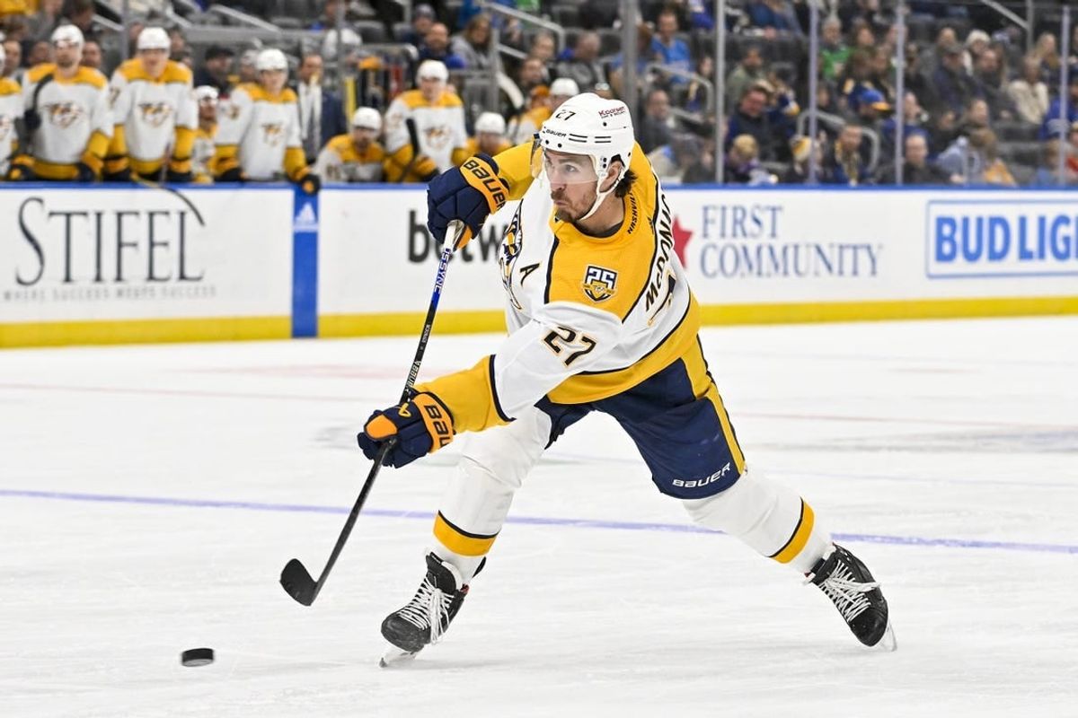 Nov 24, 2023; St. Louis, Missouri, USA;  Nashville Predators defenseman Ryan McDonagh (27) shoots against the St. Louis Blues during the third period at Enterprise Center.