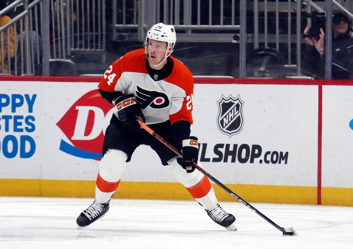 Feb 25, 2024; Pittsburgh, Pennsylvania, USA;  Philadelphia Flyers defenseman Nick Seeler (24) handles the puck against the Pittsburgh Penguins during the first period at PPG Paints Arena.