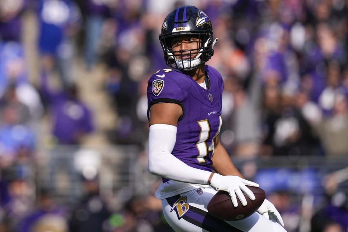 Nov 12, 2023; Baltimore, Maryland, USA;  Baltimore Ravens safety Kyle Hamilton (14) celebrates after scoring a touchdown against the Cleveland Browns during the first quarter at M&T Bank Stadium.
