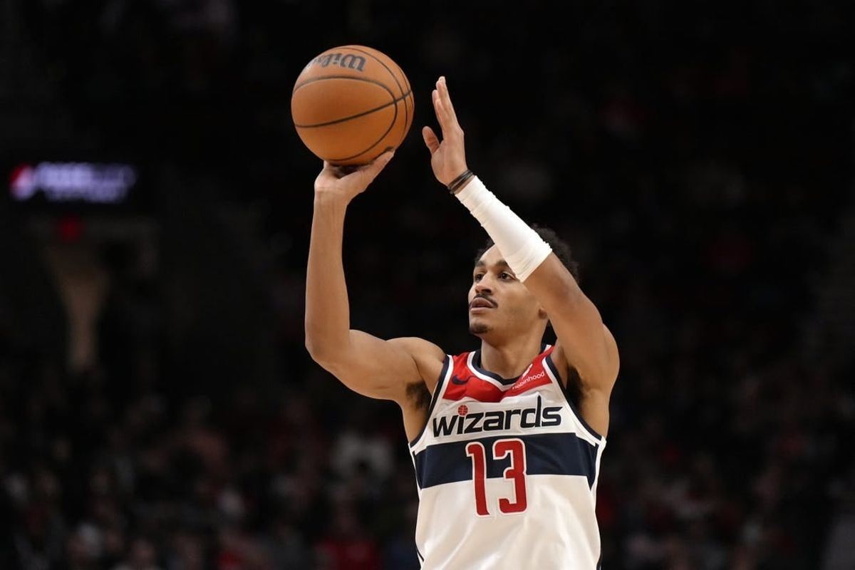 Dec 21, 2023; Portland, Oregon, USA; Washington Wizards shooting guard Jordan Poole (13) shoots the ball during the first half against the Portland Trail Blazers at Moda Center.