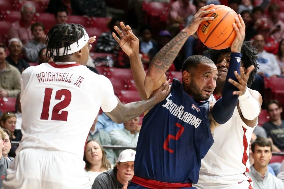 Nov 14, 2023; Tuscaloosa, Alabama, USA; South Alabama guard Isiah Gaiter (2) fights for the ball against Alabama guard Latrell Wrightsell Jr. (12) and guard Davin Cosby Jr. (4) during the second half Coleman Coliseum.