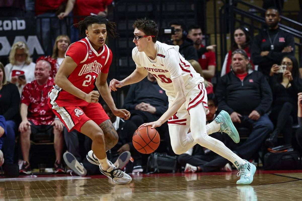 Mar 10, 2024; Piscataway, New Jersey, USA;Rutgers Scarlet Knights guard Gavin Griffiths (10) dribbles against Ohio State Buckeyes forward Devin Royal (21) during the first half at Jersey Mike's Arena.