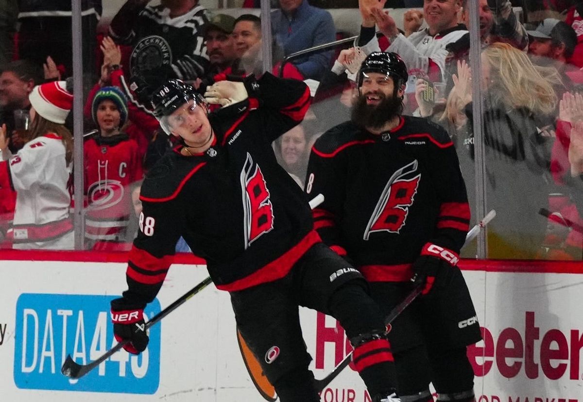Jan 19, 2024; Raleigh, North Carolina, USA;  Carolina Hurricanes center Martin Necas (88) celebrates his goal against the Detroit Red Wings during the second period at PNC Arena.