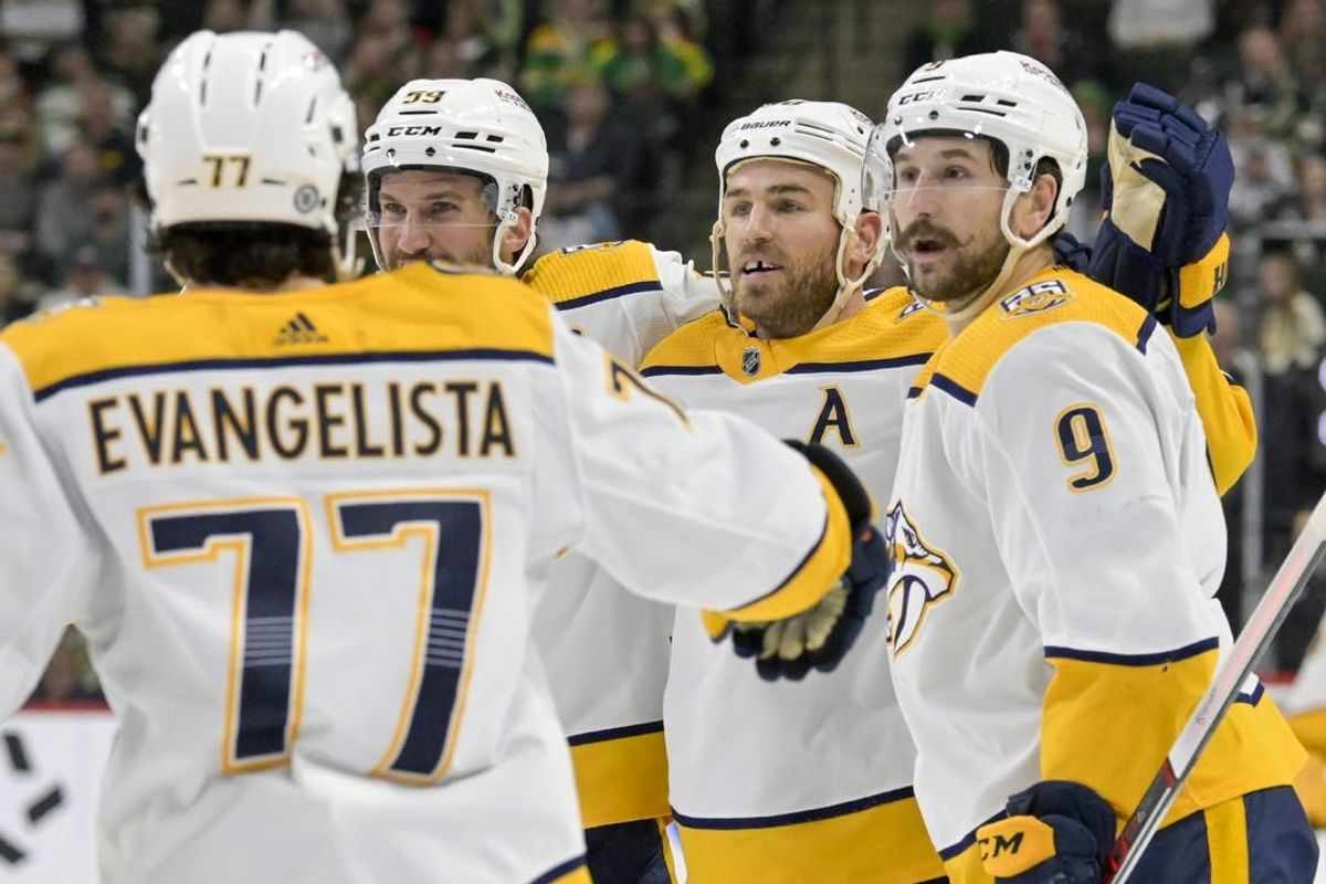 Mar 10, 2024; Saint Paul, Minnesota, USA;  Nashville Predators forward Ryan O'Reilly (90) celebrates his power play goal with defenseman Roman Josi (59) and forward Filip Forsberg (9) during the third period at Xcel Energy Center.