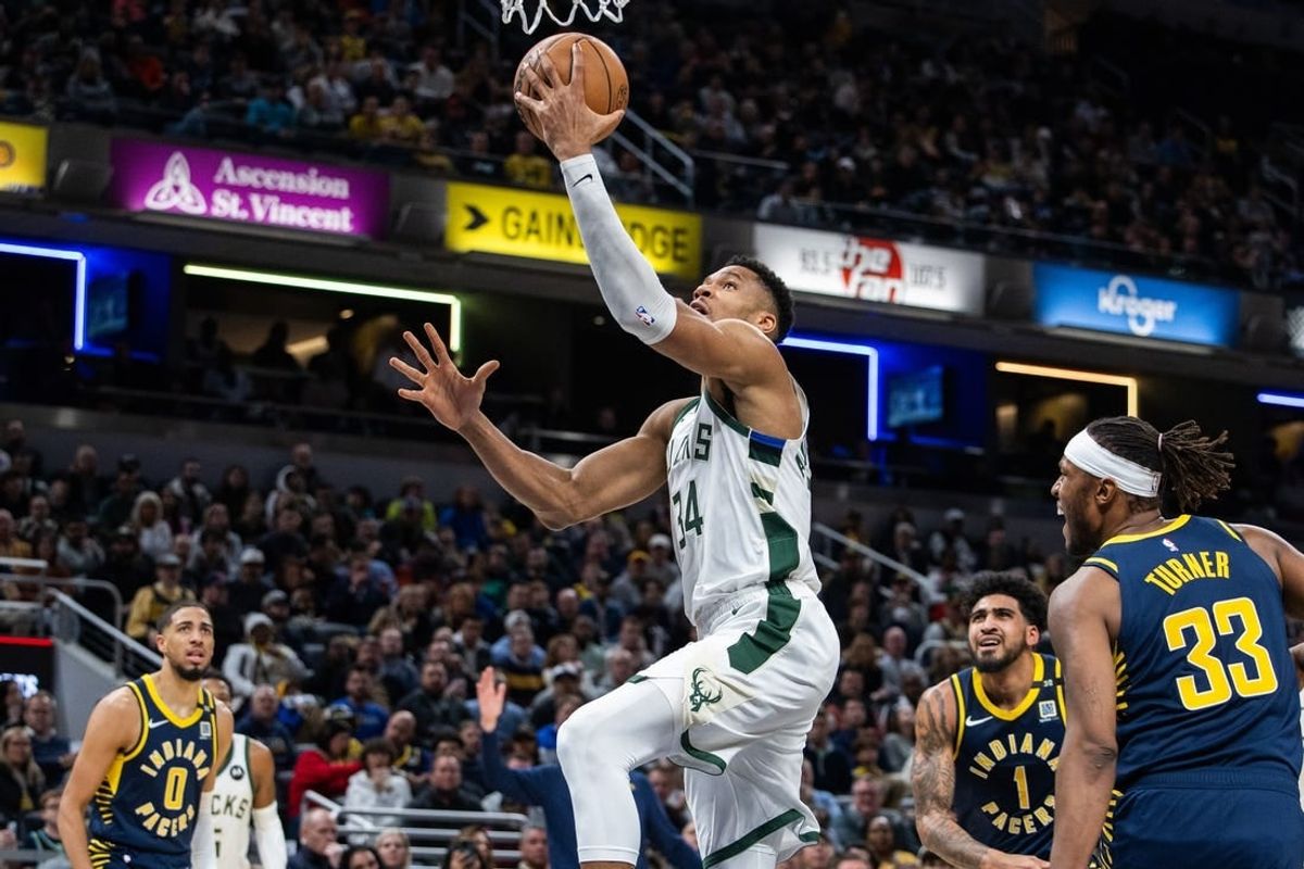 Jan 3, 2024; Indianapolis, Indiana, USA; Milwaukee Bucks forward Giannis Antetokounmpo (34) shoots the ball while Indiana Pacers center Myles Turner (33) defends in the second quarter at Gainbridge Fieldhouse.