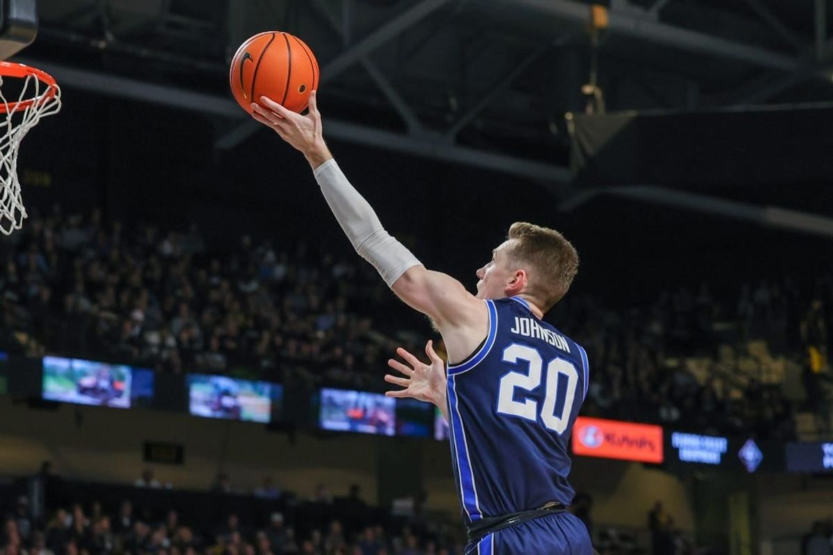 Jan 13, 2024; Orlando, Florida, USA; Brigham Young Cougars guard Spencer Johnson (20) goes to the basket during the first period against the UCF Knights at Addition Financial Arena.