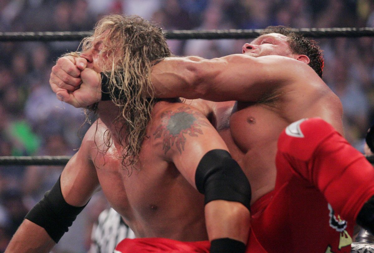 Chris Benoit (r., with Edge)