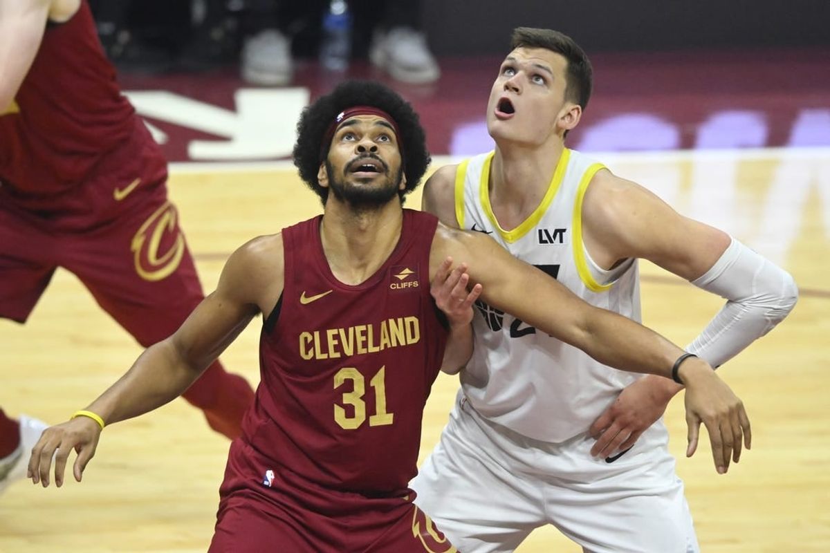 Dec 20, 2023; Cleveland, Ohio, USA; Cleveland Cavaliers center Jarrett Allen (31) and Utah Jazz center Walker Kessler (24) look to rebound in the first quarter at Rocket Mortgage FieldHouse.