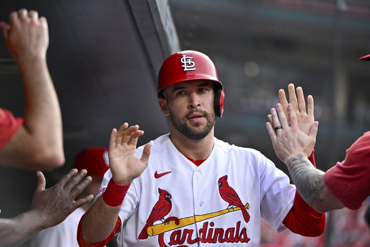Jul 17, 2023; St. Louis, Missouri, USA;  St. Louis Cardinals center fielder Dylan Carlson (3) is congaratulated by teammates after scoring against the Miami Marlins during the third inning at Busch Stadium.