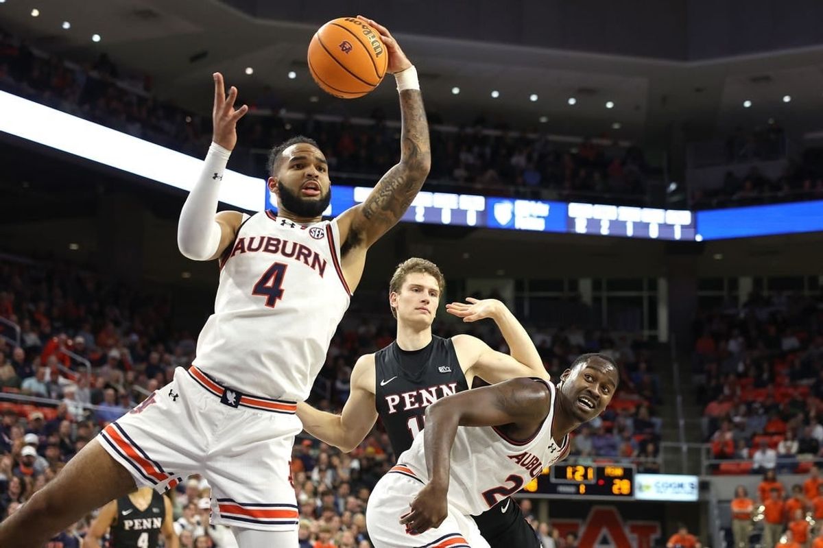Jan 2, 2024; Auburn, Alabama, USA;  Auburn Tigers forward Johni Broome (4) controls a rebound during the first half against the Pennsylvania Quakers at Neville Arena.