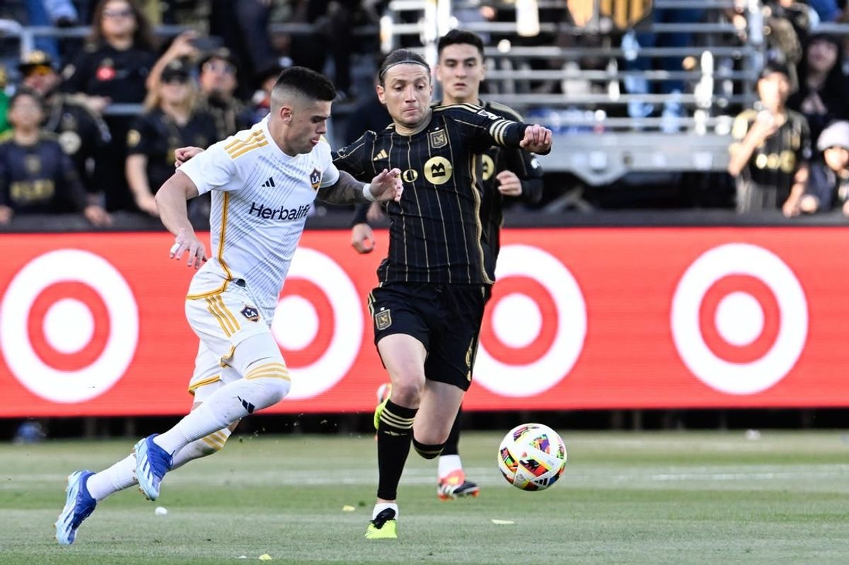 Apr 6, 2024; Los Angeles, California, USA; LA Galaxy forward Gabriel Pec (11) and LAFC midfielder Ilie Sanchez (6) chase down the ball during the first half at BMO Stadium.