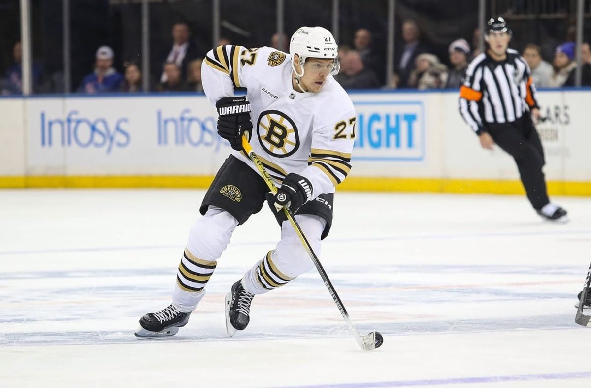 Nov 25, 2023; New York, New York, USA; Boston Bruins defenseman Hampus Lindholm (27) looks to pass against the New York Rangers during the third period at Madison Square Garden.