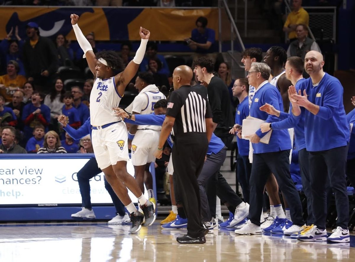 Jan 31, 2024; Pittsburgh, Pennsylvania, USA; Pittsburgh Panthers forward Blake Hinson (2) celebrates a three point basket in front of the PITT bench against the Wake Forest Demon Deacons during the second half at the Petersen Events Center. Pittsburgh won 77-72.