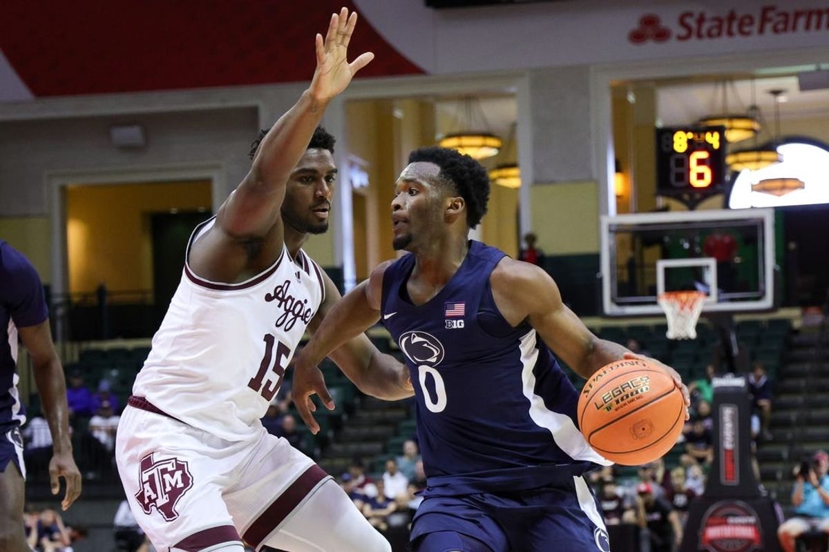 Nov 23, 2023; Kissimmee, FL, USA;  Penn State Nittany Lions guard Kanye Clary (0) drives to the hoop guarded by Texas A&M Aggies forward Henry Coleman III (15) in the first half during the ESPN Events Invitational at State Farm Field House.