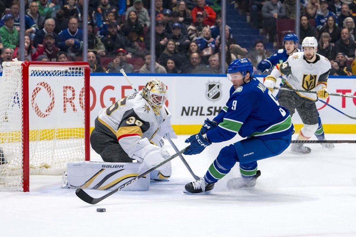 Apr 8, 2024; Vancouver, British Columbia, CAN; Vegas Golden Knights goalie Logan Thompson (36) makes a save on Vancouver Canucks forward J.T. Miller (9) in the first period at Rogers Arena.