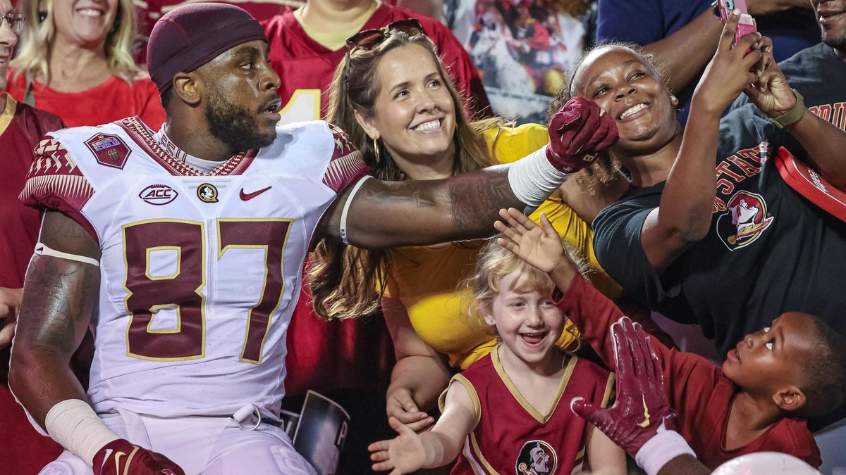 Florida State’s Camren McDonald celebrates with fans after a win over the Louisville Cardinals