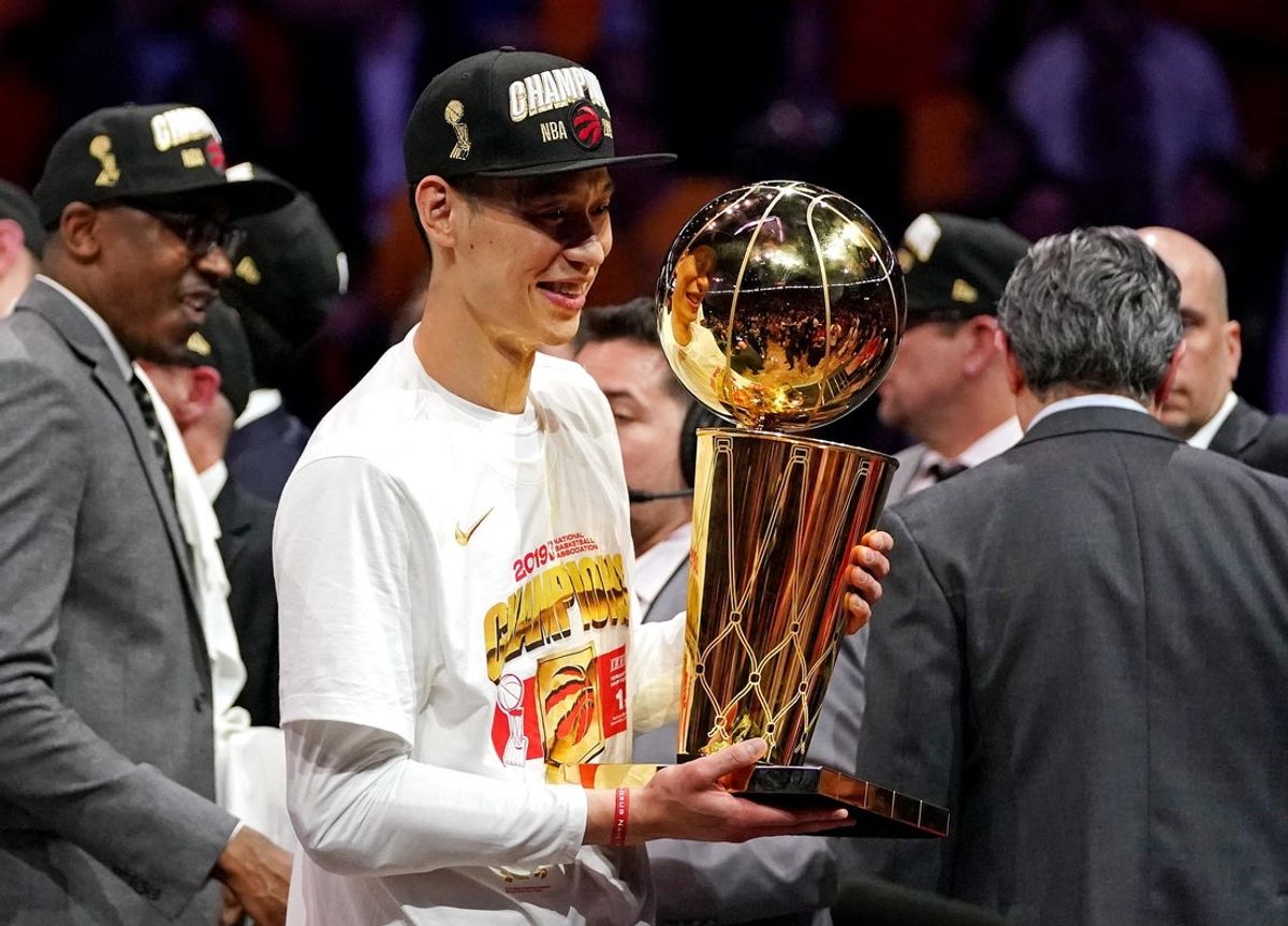 Jun 13, 2019; Oakland, CA, USA; Toronto Raptors guard Jeremy Lin (17) celebrates with the Larry O'Brian Trophy after beating the Golden State Warriors in game six of the 2019 NBA Finals at Oracle Arena. Mandatory Credit: Kyle Terada-Imagn Images