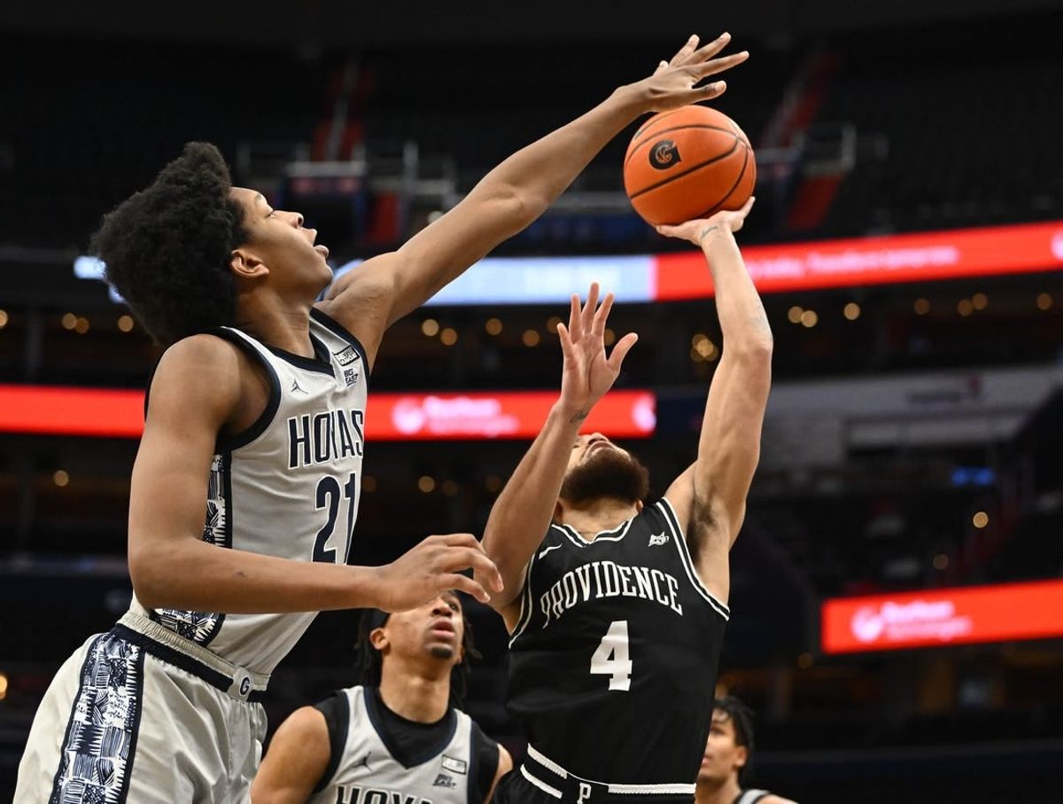 Feb 6, 2022; Washington, District of Columbia, USA; Georgetown Hoyas center Ryan Mutombo (21) defends the shot by Providence Friars guard Jared Bynum (4) during the second half at Capital One Arena.