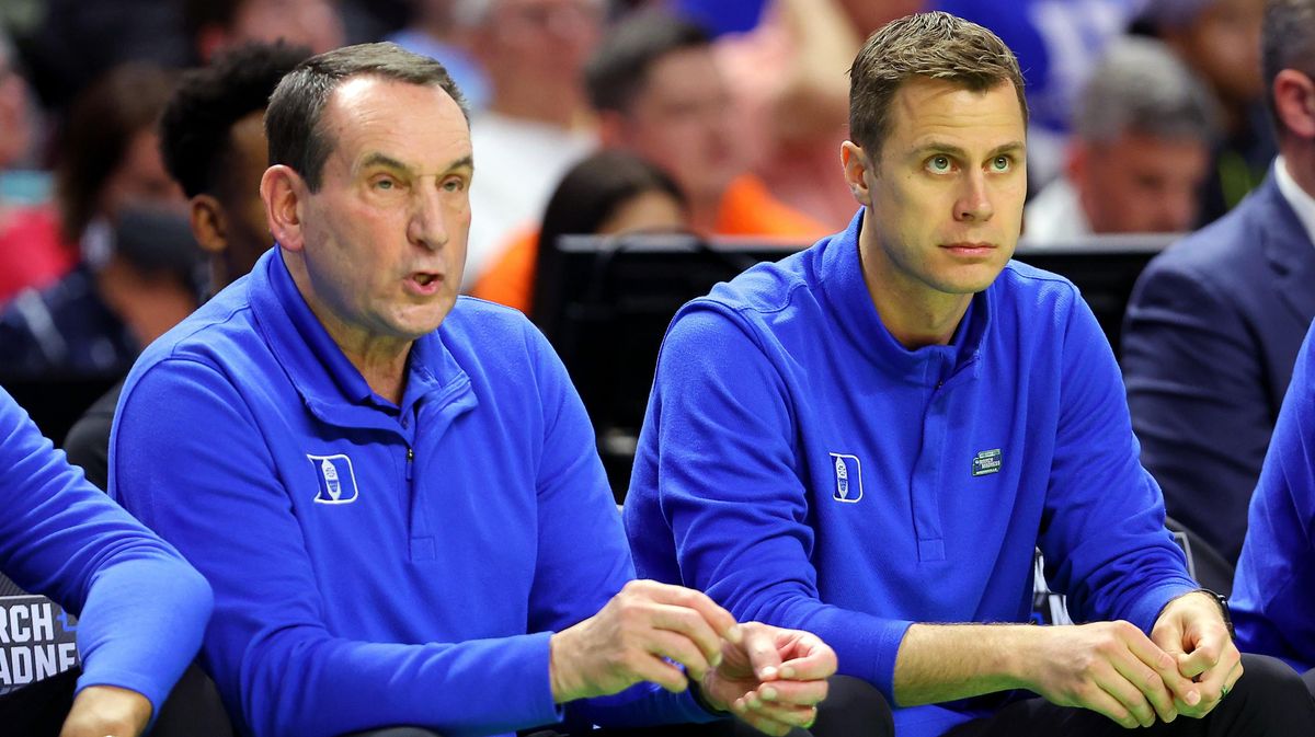 Former Duke head coach Mike Krzyzewski and new head coach Jon Scheyer look on during the first half against the Cal State Fullerton Titans in the first round game of the 2022 NCAA Men’s Basketball Tournament.