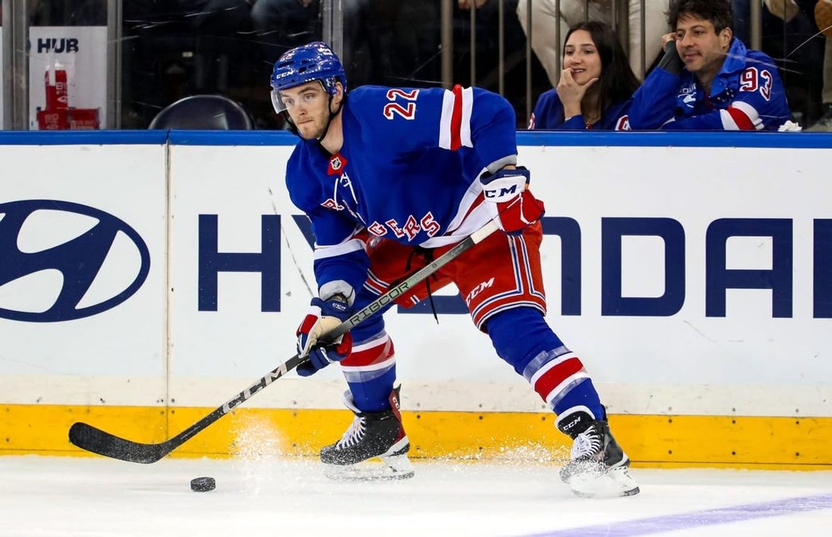 Jan 2, 2024; New York, New York, USA; New York Rangers center Jonny Brodzinski (22) looks to pass against the Carolina Hurricanes during the third period at Madison Square Garden.