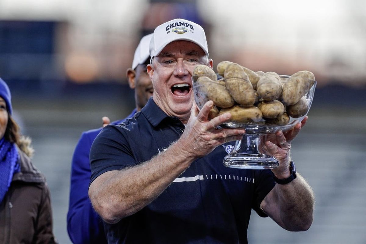 Dec 23, 2023; Boise, ID, USA; Georgia State Panthers head coach Shawn Elliott hoists the Famous Idaho Potato Bowl trophy after the game against the Utah State Aggies at Albertsons Stadium. Georgia State defeats Utah State 45-22.