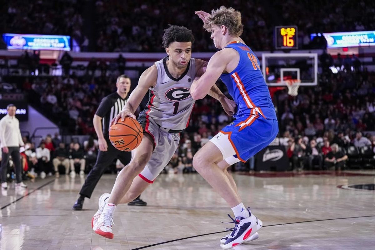 Feb 17, 2024; Athens, Georgia, USA; Georgia Bulldogs guard Jabri Abdur-Rahim (1) dribbles against Florida Gators forward Thomas Haugh (10) during the first half at Stegeman Coliseum.