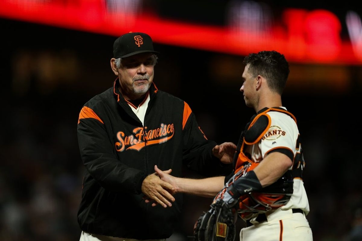 Aug 13, 2019; San Francisco, CA, USA; San Francisco Giants catcher Buster Posey (28) celebrates with manager Bruce Bochy (15) after defeating the Oakland Athletics at Oracle Park. Mandatory Credit: Sergio Estrada-Imagn Images
