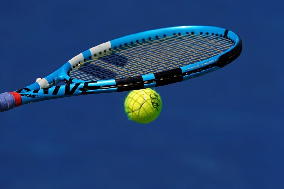 Aug 15, 2019; Mason, OH, USA; A view of the Western and Southern Open tennis ball on the racquet of Rebecca Peterson (SWE) as she prepares to serve against Karolina Pliskova (CZE) during the Western and Southern Open tennis tournament at Lindner Family Tennis Center. Mandatory Credit: Aaron Doster-Imagn Images