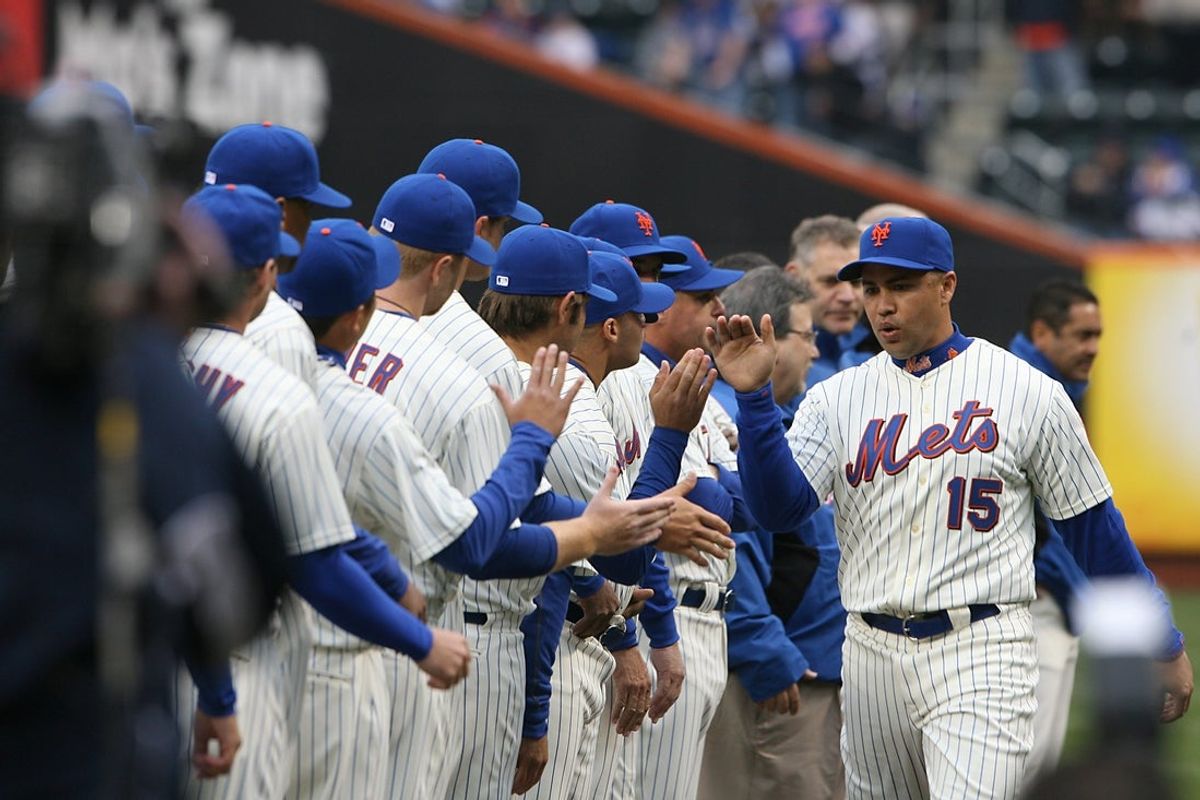 Mets home opener vs. Washington Nationals.  (right) NY Mets #15 Carlos Beltran takes the field during the opening ceremonies before the start of the game.

Beltran 1
