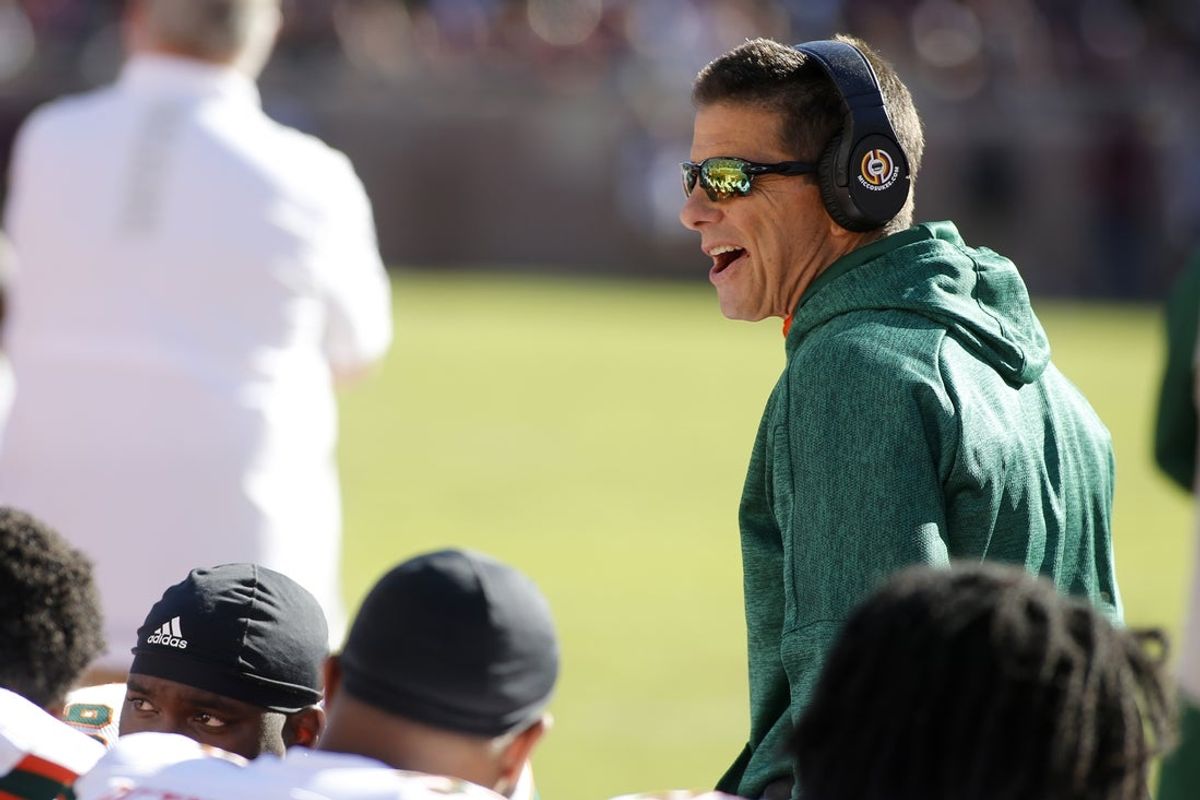 Nov 2, 2019; Tallahassee, FL, USA; Miami Hurricanes defensive coordinator Blake Baker talks to his players during the second quarter against the Florida State Seminoles at Doak Campbell Stadium. Mandatory Credit: Glenn Beil-Imagn Images