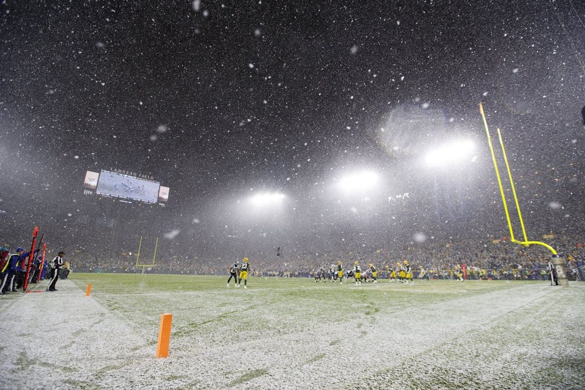 General view of snow falling during the fourth quarter at Lambeau Field. Mandatory Credit: Jeff Hanisch-Imagn Images