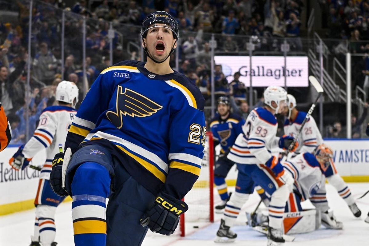 Feb 15, 2024; St. Louis, Missouri, USA;  St. Louis Blues center Jordan Kyrou (25) reacts after scoring against Edmonton Oilers goaltender Stuart Skinner (74) during the second period at Enterprise Center.