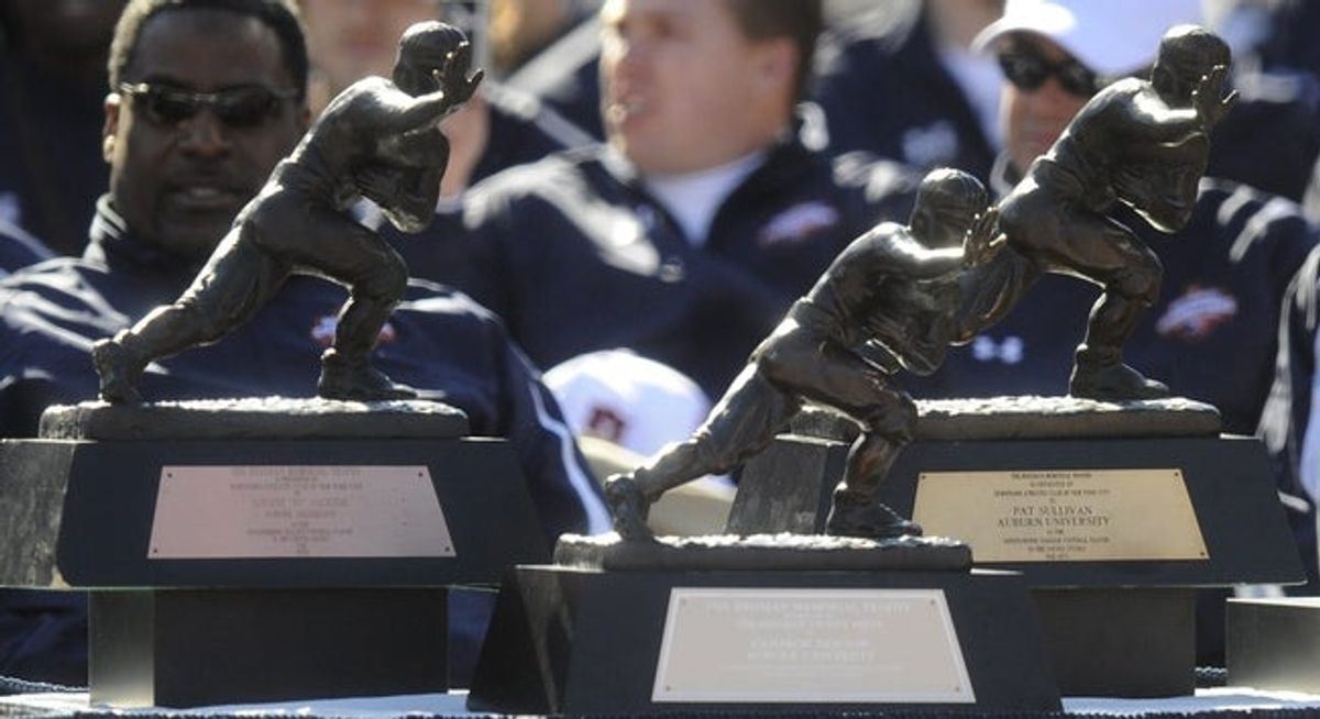 Cam Newton's Heisman Trophy joins those of Bo Jackson and Pat Sullivan on stage during the National Championship Celebration at Jordan Hare Stadium on the Auburn University campus in Auburn, Ala. on Saturday January 22, 2011.(Montgomery Advertiser, Mickey Welsh)

Au36