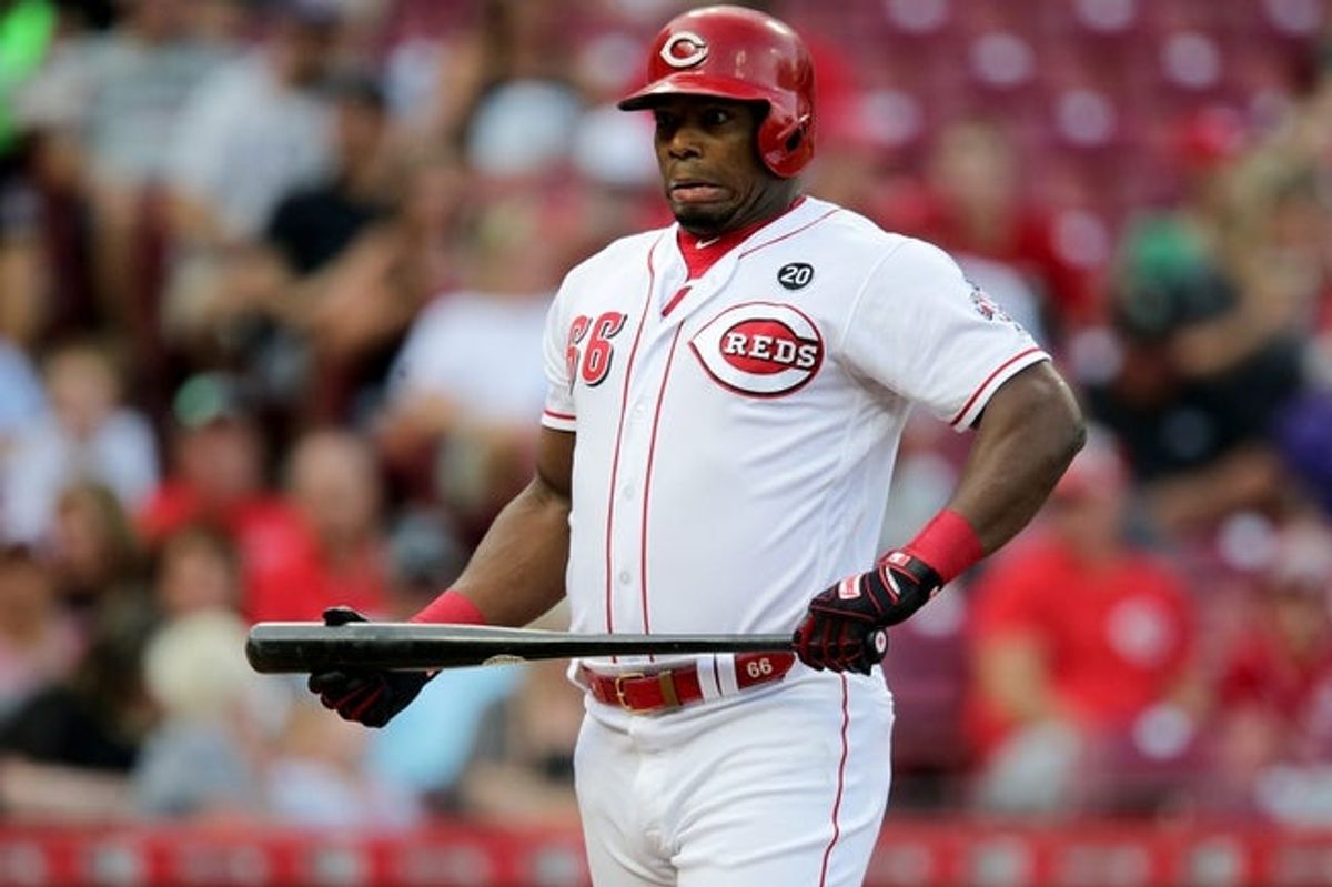 Cincinnati Reds right fielder Yasiel Puig (66) reacts after a pitch in the first inning of an MLB baseball game against the Colorado Rockies, Friday, July 26, 2019, at Great American Ball Park in Cincinnati.

Colorado Rockies At Cincinnati Reds July 26