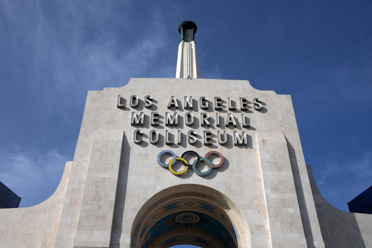 Dec 29, 2019; Los Angeles, California, USA; A general view of the Olympic rings on the  Los Angeles Memorial Coliseum peristyle and torch prior to the Los Angeles Rams final home against the Arizona Cardinals before moving to SoFi Stadium for the 2020 season . Mandatory Credit: Kirby Lee-Imagn Images