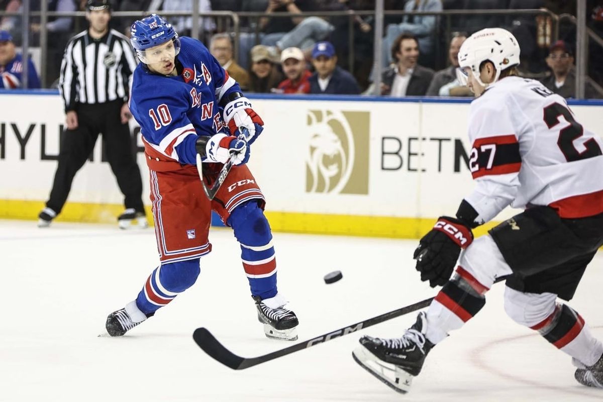 Apr 15, 2024; New York, New York, USA;  New York Rangers left wing Artemi Panarin (10) attempts a shot on goal past Ottawa Senators left wing Parker Kelly (27) in the third period at Madison Square Garden.