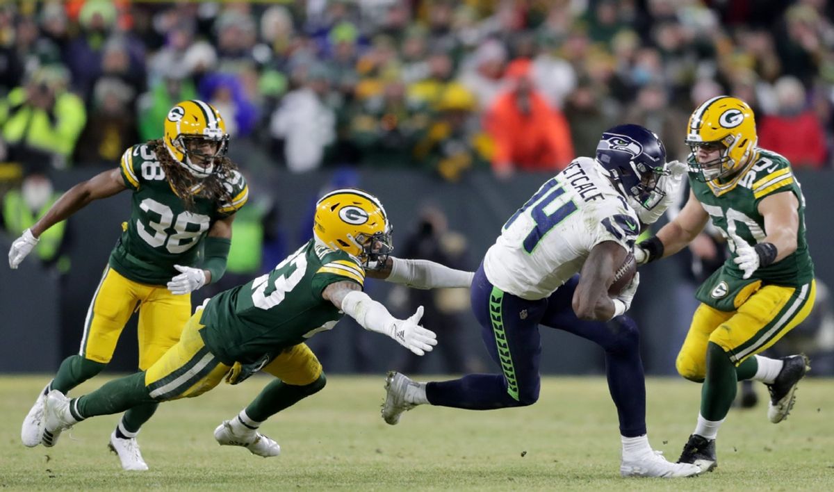 Green Bay Packers cornerback Jaire Alexander (23) and inside linebacker Blake Martinez (50) chase Seattle Seahawks wide receiver D.K. Metcalf (14) during their NFC divisional round playoff football game on Sunday, January 12, 2020, at Lambeau Field in Green Bay, Wis. Green Bay defeated Seattle 28-23.

Apc Packers Vs Seahawks 1631 011220 Wag