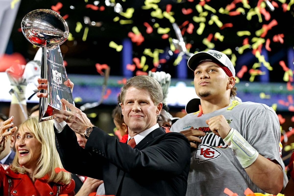Feb 2, 2020; Miami Gardens, Florida, USA;  Kansas City Chiefs owner Clark Hunt and Kansas City Chiefs quarterback Patrick Mahomes (15) celebrate with the Vince Lombardi Trophy in Super Bowl LIV at Hard Rock Stadium. Mandatory Credit: Matthew Emmons-Imagn Images