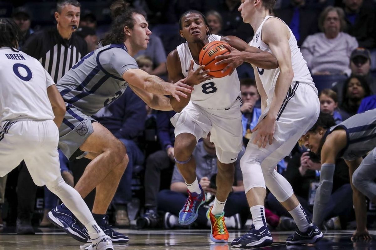Jan 16, 2024; Cincinnati, Ohio, USA; Xavier Musketeers guard Quincy Olivari (8) dribbles against Butler Bulldogs forward Boden Kapke (33) in the first half at Cintas Center.