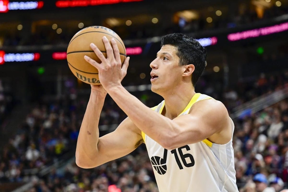 Nov 25, 2023; Salt Lake City, Utah, USA; Utah Jazz forward Simone Fontecchio (16) shoots the ball against the New Orleans Pelicans during the first half at Delta Center.