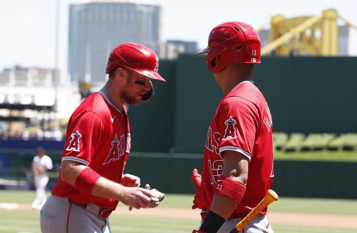May 8, 2024; Pittsburgh, Pennsylvania, USA;  Los Angeles Angels first baseman Brandon Drury (left) celebrates scoring a run with second baseman Ehire Adrianza (13) against the Pittsburgh Pirates during the fifth inning at PNC Park.