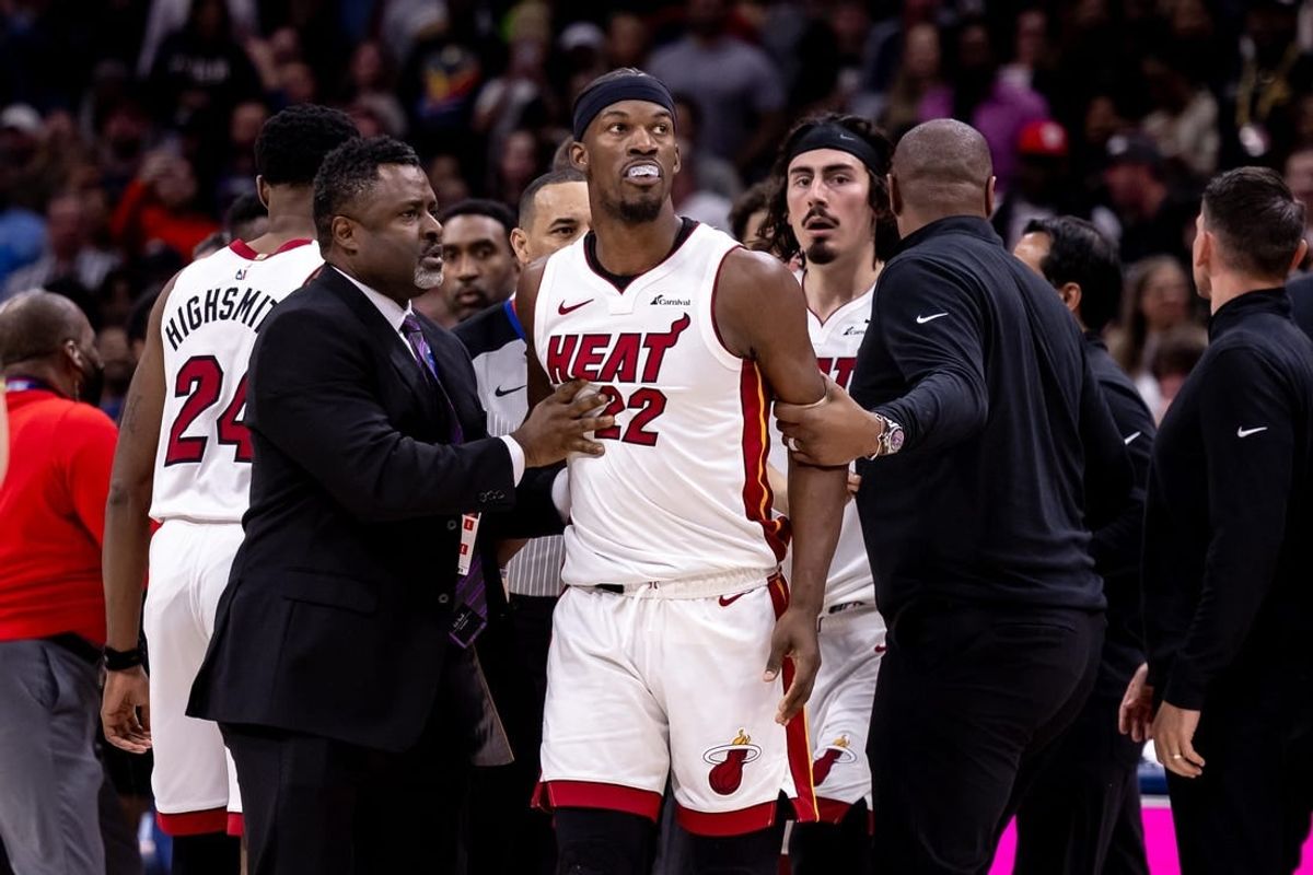 Feb 23, 2024; New Orleans, Louisiana, USA;  Miami Heat forward Jimmy Butler (22) and New Orleans Pelicans forward Naji Marshall (8) and guard Jose Alvarado (15) are ejected after a melee due to a play during the second half at Smoothie King Center.