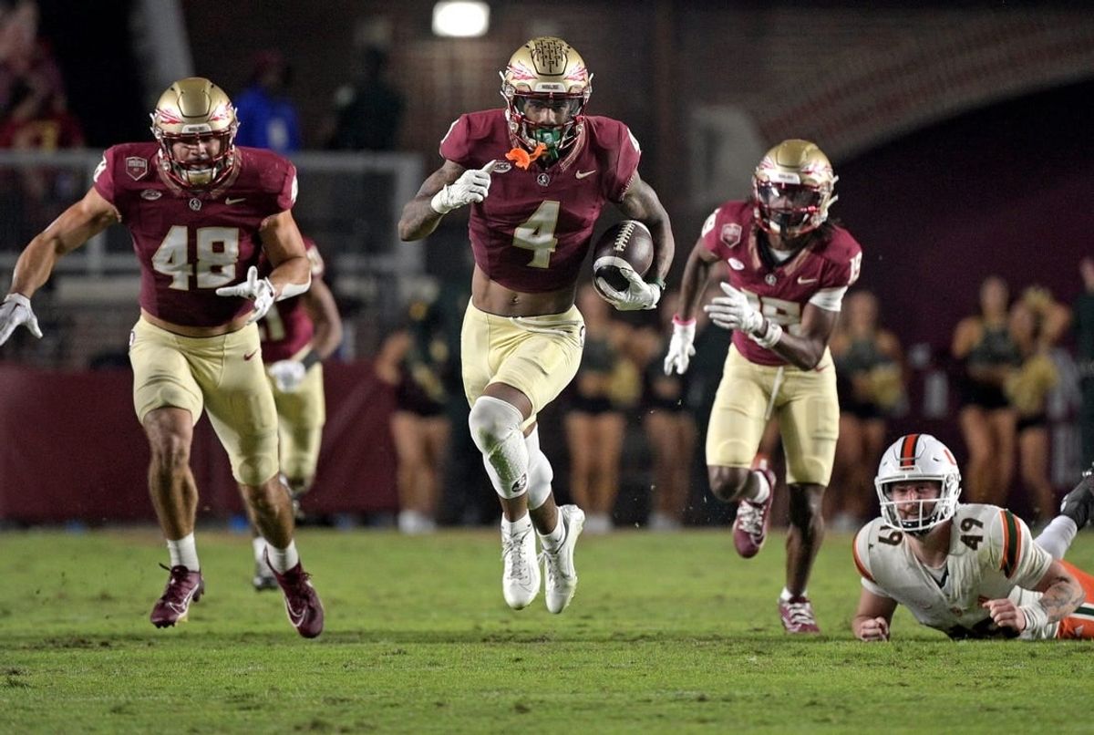 Nov 11, 2023; Tallahassee, Florida, USA; Florida State Seminoles wide receiver Keon Coleman (4) returns a punt in the second half against the Miami Hurricanes at Doak S. Campbell Stadium.