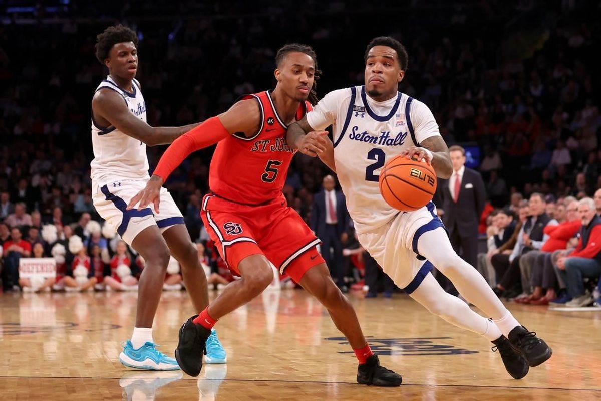 Mar 14, 2024; New York City, NY, USA; Seton Hall Pirates guard Al-Amir Dawes (2) drives to the basket against St. John's Red Storm guard Daniss Jenkins (5) during the second half at Madison Square Garden.