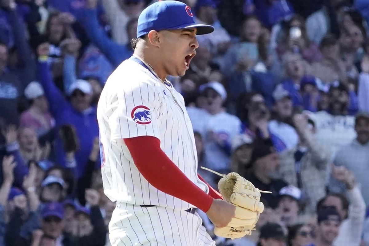 May 5, 2024; Chicago, Illinois, USA; Chicago Cubs pitcher Daniel Palencia (48) celebrates getting the final out against the Milwaukee Brewers at Wrigley Field.